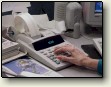 Hand calculating a bill